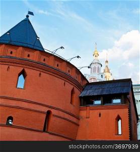 old wall of historical Kitay-gorod and towers of Zaikonospassky monastery in Moscow