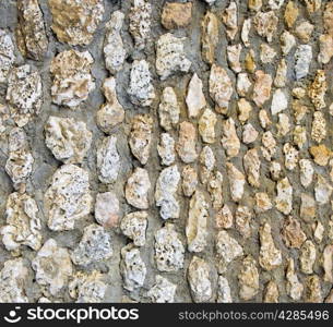 old wall of rough stones as background