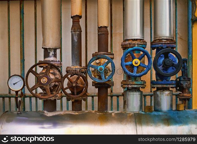 old water steam leak valve in old industry factory