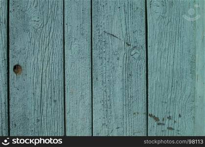 Old weathered blue painted grunge wooden board wall closeup as background