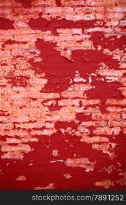 Old weathered painted red brick wall fragment grunge background