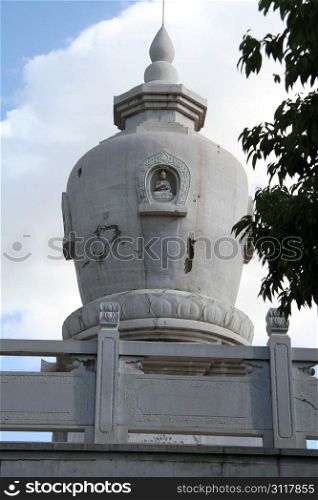 Old white buddhist stupa in Kunming, China