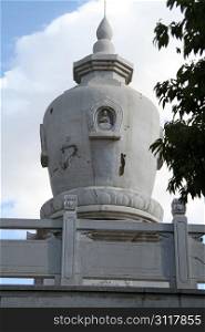 Old white buddhist stupa in Kunming, China
