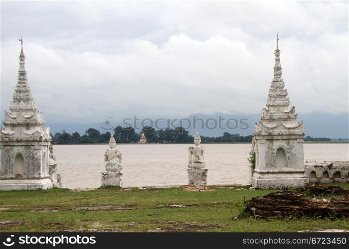 Old white stiupas on the bank of river in Mingun, Myanmar