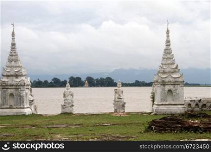 Old white stiupas on the bank of river in Mingun, Myanmar