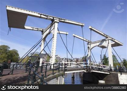 old white wooden drawbridge in centre of amsterdam over nieuwe herengracht