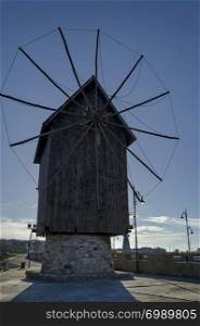Old Windmill by insthmus to old Nessebar Bulgaria. The windmill is wooden.