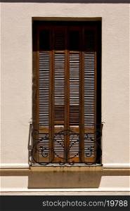 old window grate and terrace in the centre of colonia del sacramento uruguay&#xA;