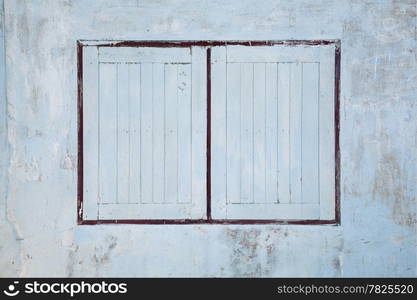 Old windows old wood windows. Old house paint peeling of the walls and windows.