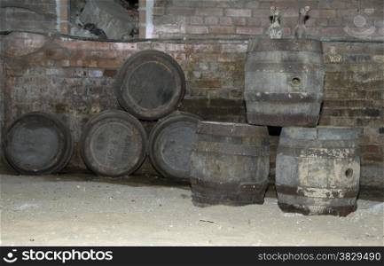 old wine vessels full of dust in a ancient chellar