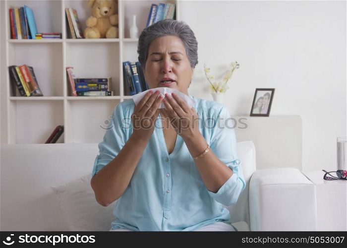 Old woman about to sneeze