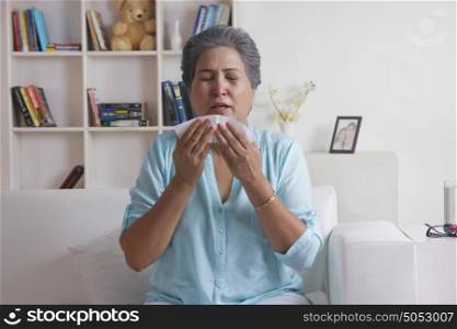 Old woman about to sneeze