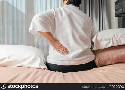 Old woman back pain at home, health problem concept