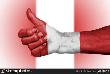 Old woman giving the thumbs up sign, isolated, flag of Peru