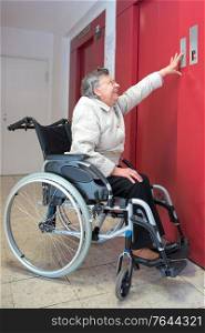 old woman in a wheelchair using lift