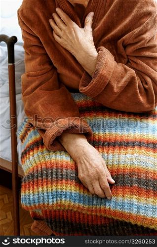 old woman in hospital, selective focus on nearest hand