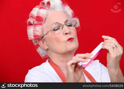 Old woman in rollers