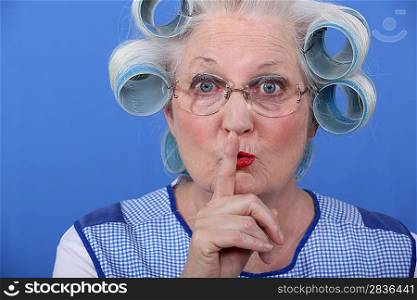 Old woman requesting to be quiet