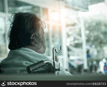 Old woman sit on wheelchair,Vintage Style.