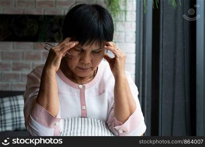 old woman suffering from headache, stress, migraine, health problem concept
