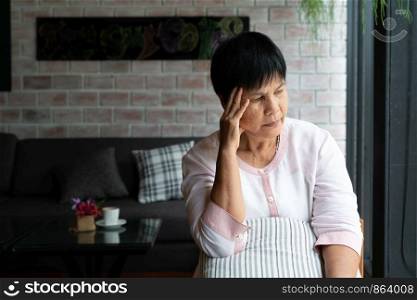 old woman suffering from headache, stress, migraine, health problem concept