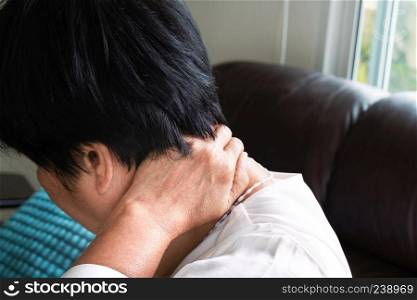 old woman suffering from neck and shoulder pain, health problem concept