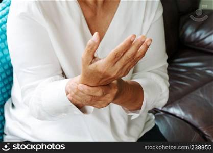 old woman suffering from wrist hand pain, health problem concept