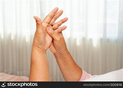 old woman suffering from wrist hand pain, health problem concept