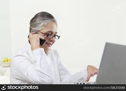 Old woman talking on a mobile phone