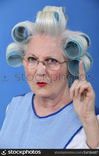 Old woman waving her finger in disapproval