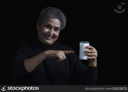 Old woman with glass of milk