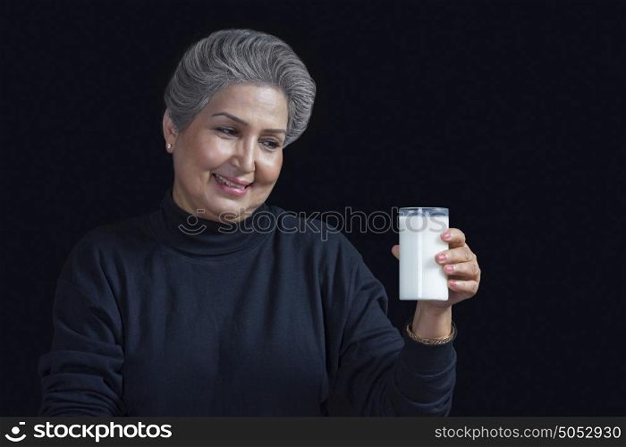 Old woman with glass of milk