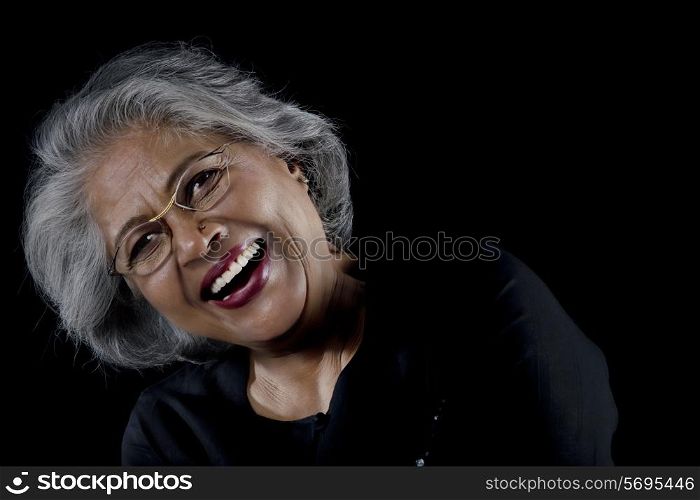 Old woman with glasses laughing