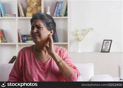 Old woman with pain in ear