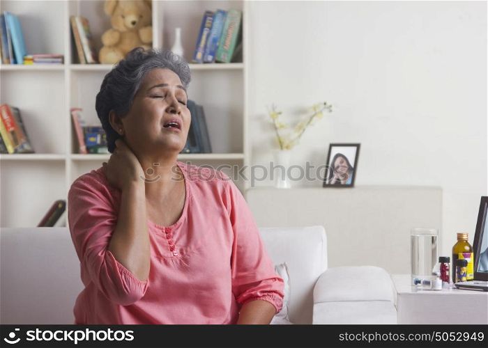 Old woman with pain in neck