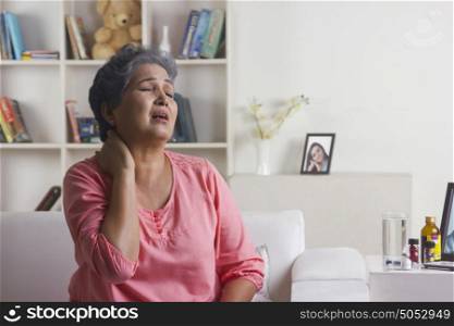 Old woman with pain in neck