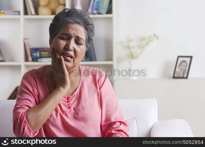 Old woman with toothache