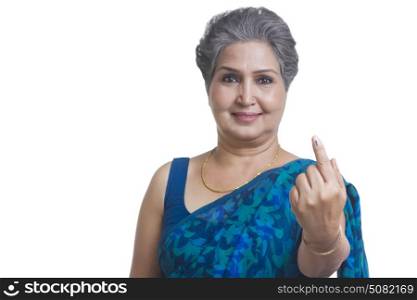 Old woman with voters mark on finger