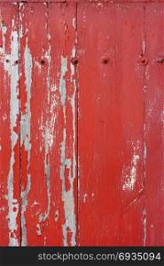 Old wood board painted red, background texture. Old wood board painted red