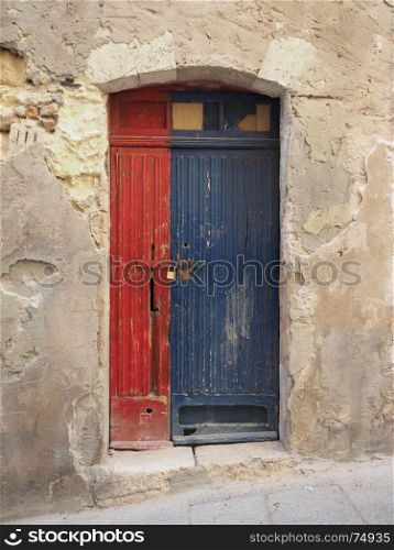 old wood door. a red and blue old wooden door