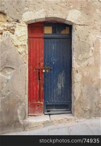 old wood door. a red and blue old wooden door
