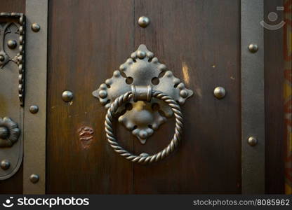 old wood door metal knocker close detail