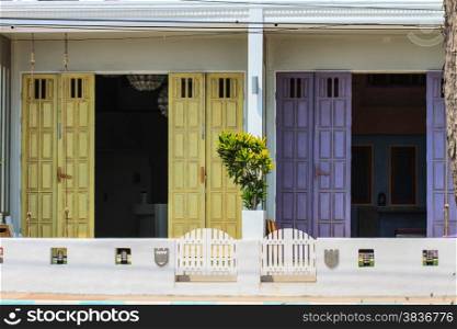 Old wood door with colorful, design vintage building