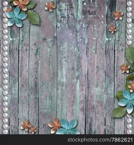 Old wooden background with a flowers, pearls