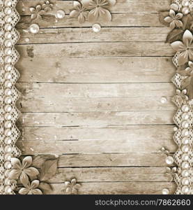 Old wooden background with a flowers, pearls