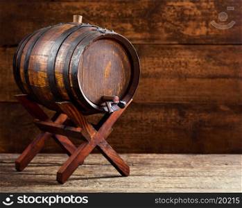 old wooden barrel on rustic wooden background