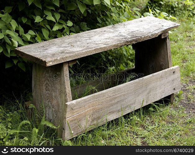 old wooden bench. old wooden bench in a garden
