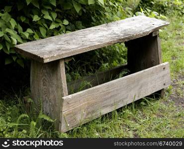 old wooden bench. old wooden bench in a garden