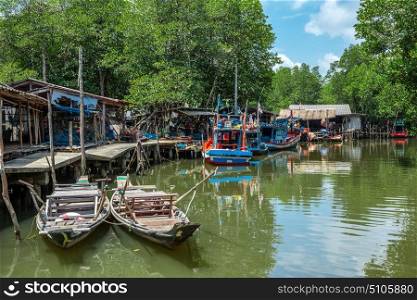 Old wooden boat in the fishing village of Thailand