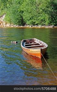 old wooden boat on the river